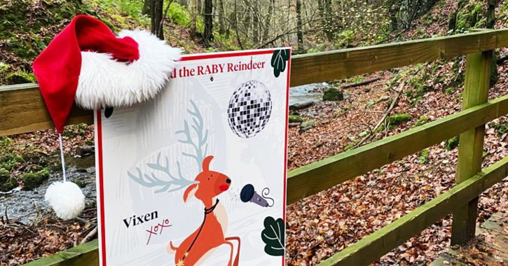 View of a sign with Christmas Santa hat on the Reindeer Trail at High Force Waterfall